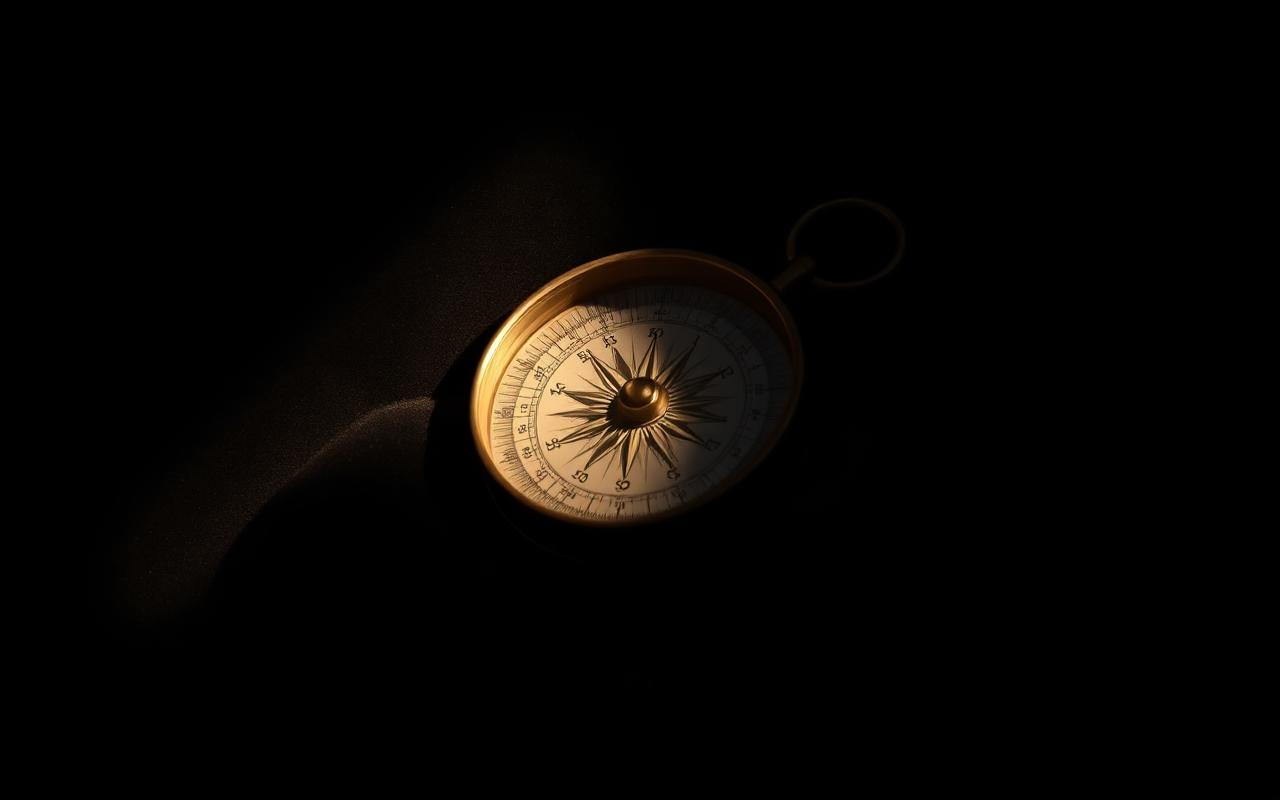 Boussole en laiton sur velours noir éclairée par un faisceau lumineux — symbole de la navigation intérieure après le trauma.